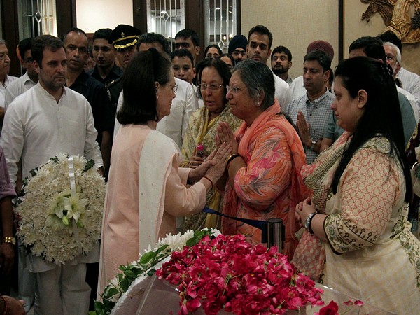 Congress interim president Sonia Gandhi with Arun Jaitley's wife Sangeeta Jaitley in New Delhi on Saturday. Photo/ANI