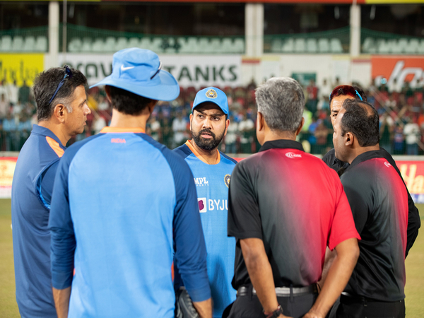 India captain Rohit Sharma with head coach Rahul Dravid and on-field umpires (Image: BCCI Twitter)