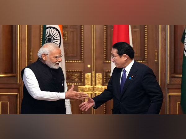 Indian Prime Minister Narendra Modi and Japanese Prime Minister Fumio Kishida shake hands in Tokyo in May 2022. (Photo/Reuters)