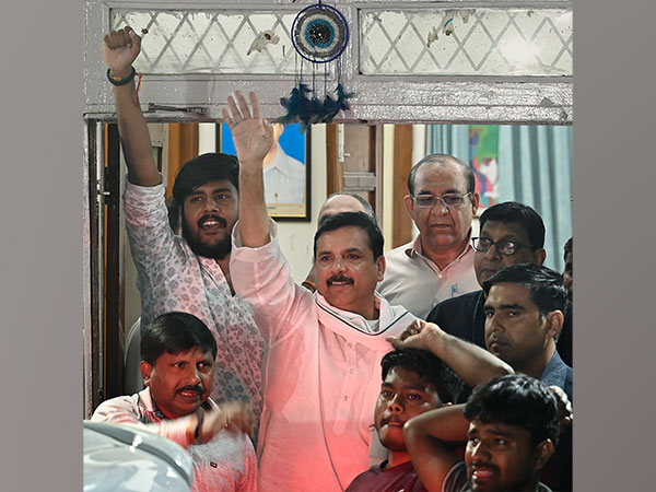 Sanjay Singh waves to his supporters (Photo/ANI)