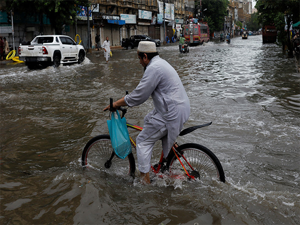Residents navigate flooded steets as heavy monsoon rains lash Punjab, Pakistan (File Photo/Reuters)