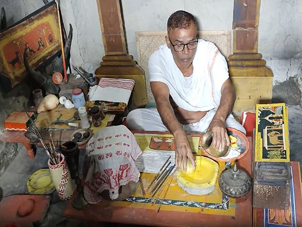 Mridul Barua doing manuscript painting in Assam's Majuli (Photo/ANI) 