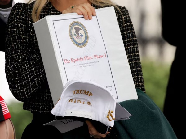 People walk out of the West Wing of the White House with "The Epstein Files: Phase 1" binders, in Washington DC (Image/Reuters)