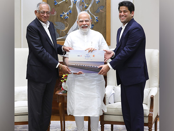 Prime Minister Narendra Modi with Venu Srinivasan and Sudarshan Venu of TVS Motor Company (Photo Credit: X/@tvsmotorcompany)