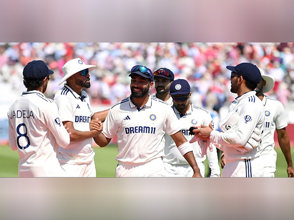 Mohammed Siraj and Jasprit Bumrah with Team India