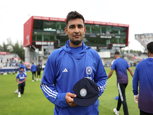 Anshul Kamboj with his Test cap. (Photo: @BCCI X)