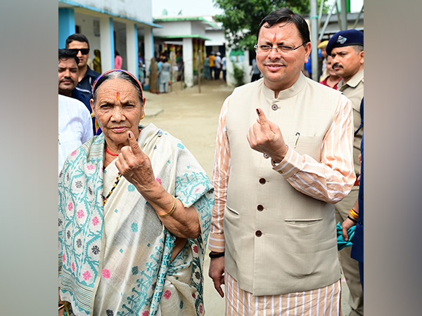 CM Pushkar Singh Dhami and mother Bishna Devi caste vote for three-tier Panchayat elections (Photo/ANI)
