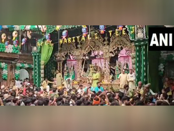 Devotees throng Vrindavan's Banke Bihari Mandir on occasion of Hariyali Teej (Photo/ANI)