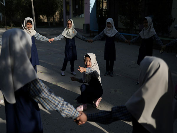 Afghan girls play in a school courtyard in Kabul, Afghanistan (File Photo/Reuters)