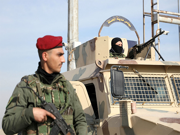 A member of the Kurdish-led Syrian Democratic Forces (SDF) stands on a street in Hasakah, Syria, following the rebels' seizure of the capital and ousting of Bashar al-Assad (File Photo/Reuters)
