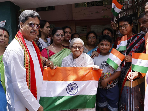 Tripura CM Manik Saha distributes national flags (Photo: ANI) 