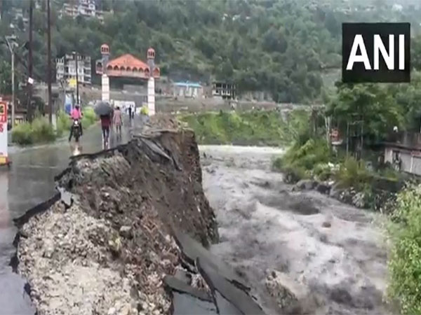 Himachal Pradesh rainfall: Road damaged near Bhoothnath bridge over raging Beas river in Kullu. (PhotoANI)