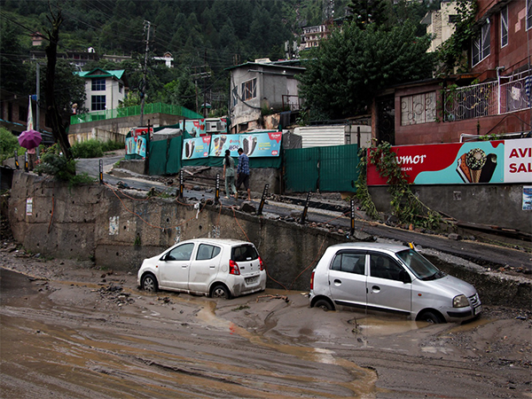 Vehicles stand stuck in silt following heavy rain in Kullu. (Photo/ANI)