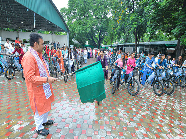 Rajasthan Chief Minister Bhajanlal Sharma distributing e-cycles to girls and working women (Photo/ANI)