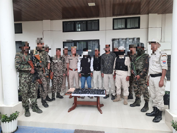 Officials with apprehended accused. (Photo/ANI)