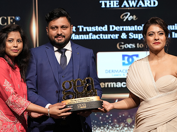 At GEA 2025, Kajol Devgan presents Viren Kalyankar, Director of Dermacell Pvt. Ltd., with the award recognizing the company as India's Most Trusted Dermatology Equipment Manufacturer & Supplier