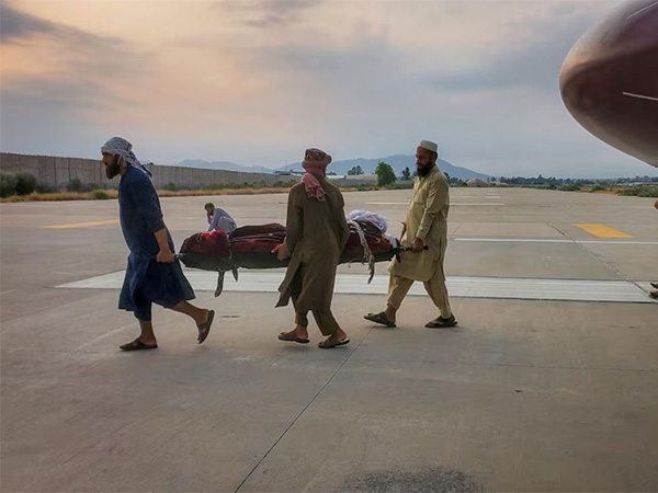 People carry an earthquake victim on a stretcher to an ambulance at an airport in Jalalabad, Afghanistan (Image/Reuters)