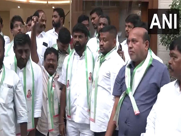 Supporters of BRS MLC K Kavitha gather outside her residence. (Photo/ANI)