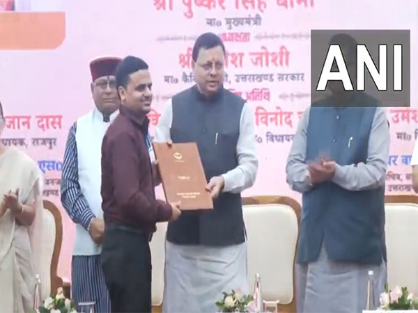 Uttarakhand CM distributes appointment letters to assistant teacher (Photo/ANI)