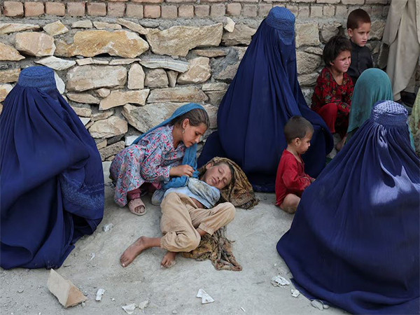 A girl takes care of her brother after a deadly earthquake that hit Nurgal district, Kunar province, Afghanistan (Image/Reuters)