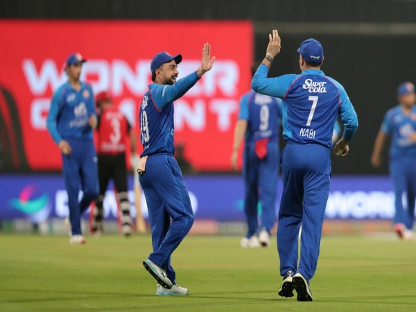 Rashid Khan celebrating with Mohammad Nabi (Photo: @ACBofficials/X)