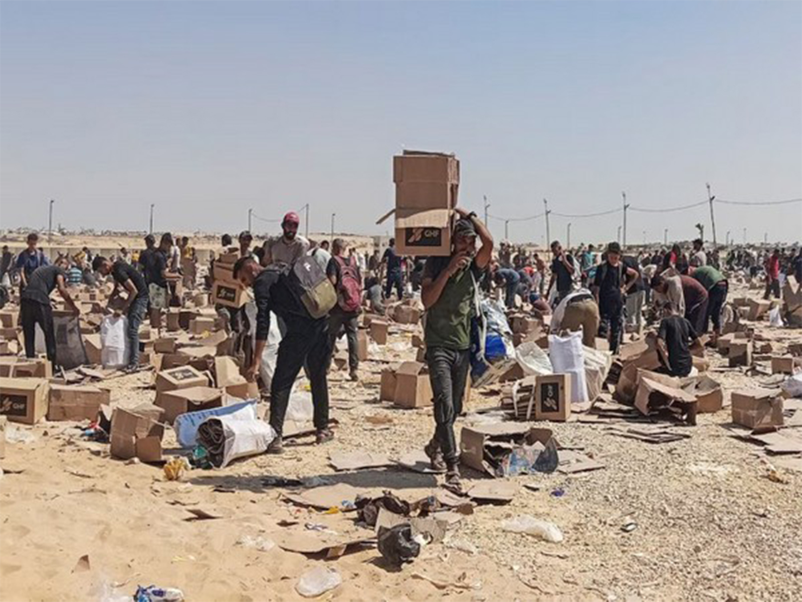 Palestinians gather to collect relief supplies from the US-backed Gaza Humanitarian Foundation's distribution centre in Rafah, southern Gaza Strip (File Photo/Reuters)