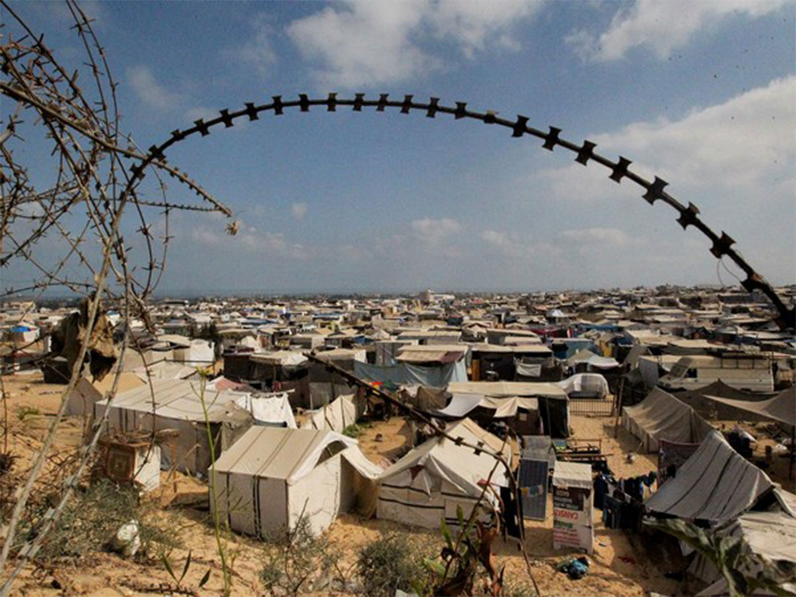 Displaced Palestinians seek shelter in the overcrowded al-Mawasi camp as Israeli airstrikes continue on Gaza City (File Photo/Reuters)