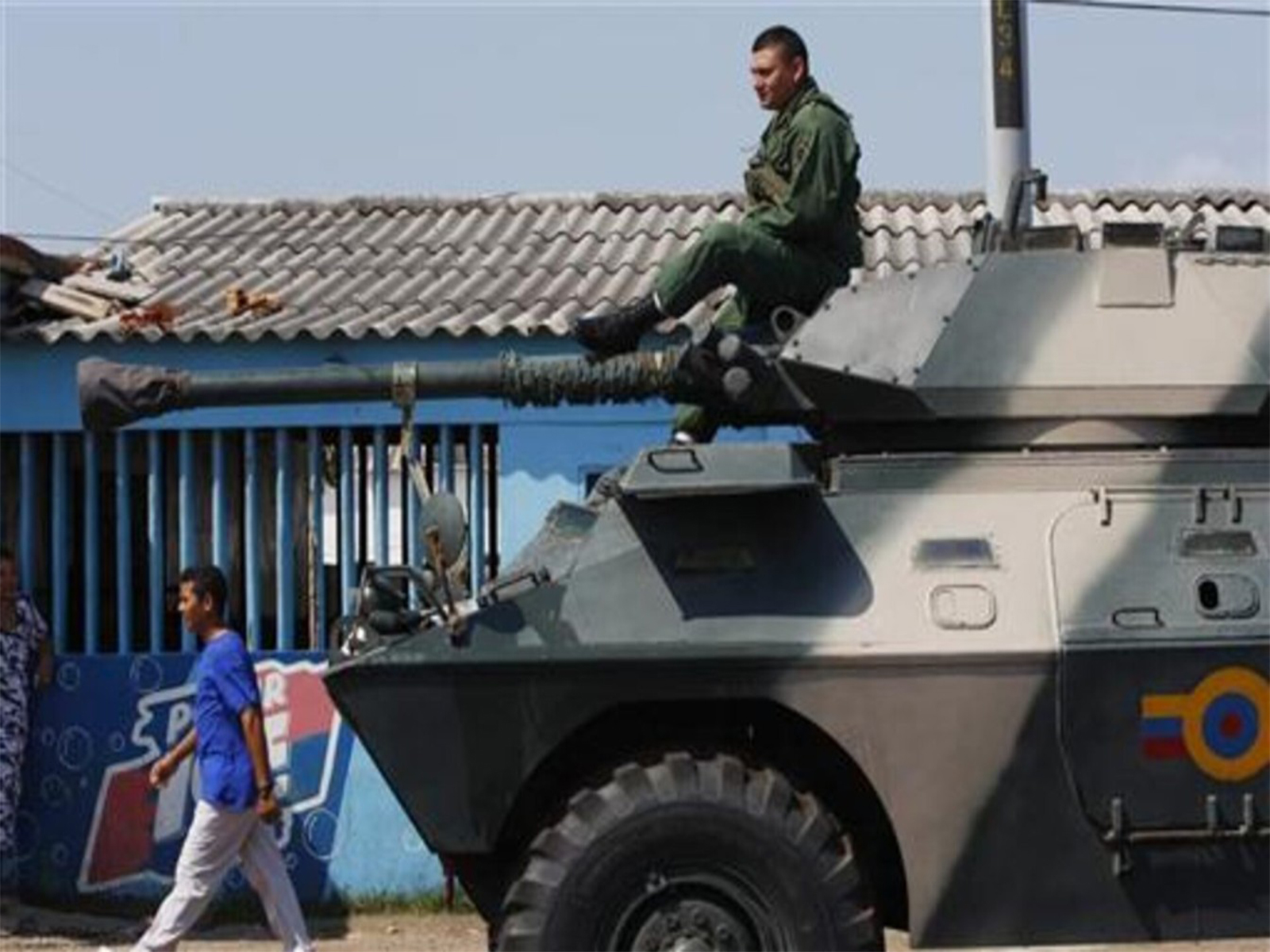 A Venezuelan soldier rides on an armoured vehicle moving through Paraguaipoa towards the Colombia border (File Photo/Reuters)