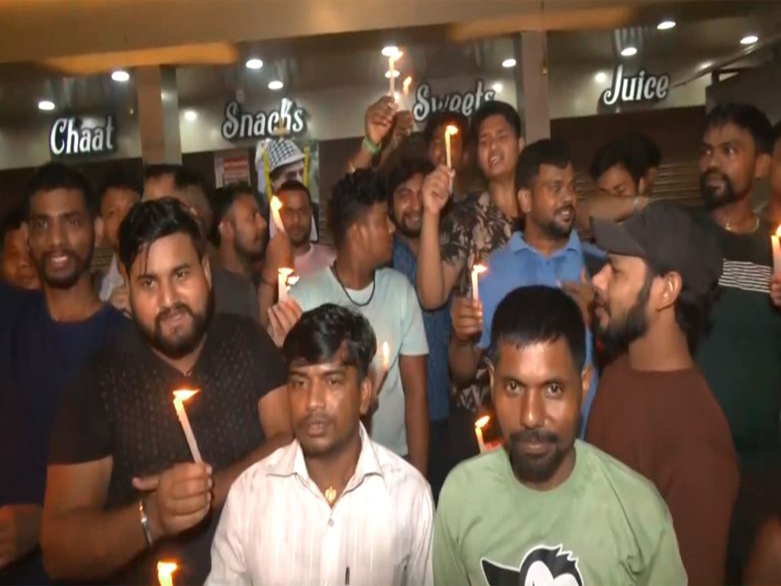 Fans in Guwahati lit candles in his memory, mourning the loss of the beloved artist. (Photo/ANI) 