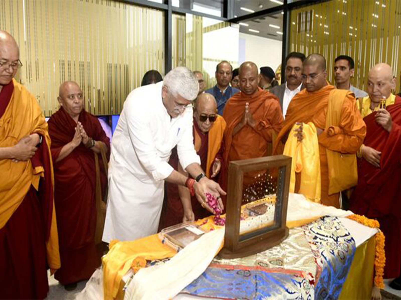 India's Minister of Culture and Tourism Gajendra Singh Shekhawat prays after he received repatriated sacred Piprahwa Gems of the Historical Buddha, at the airport in Delhi (Image/Reuters)