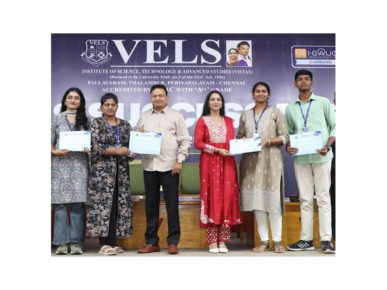 Students receiving scholarship certificates from Dr. Ishari K. Ganesh, Founder-Chancellor, and Dr. Preethaa Ganesh, Vice President, VELS Group of Institutions, during Vels Success Day 2024-25