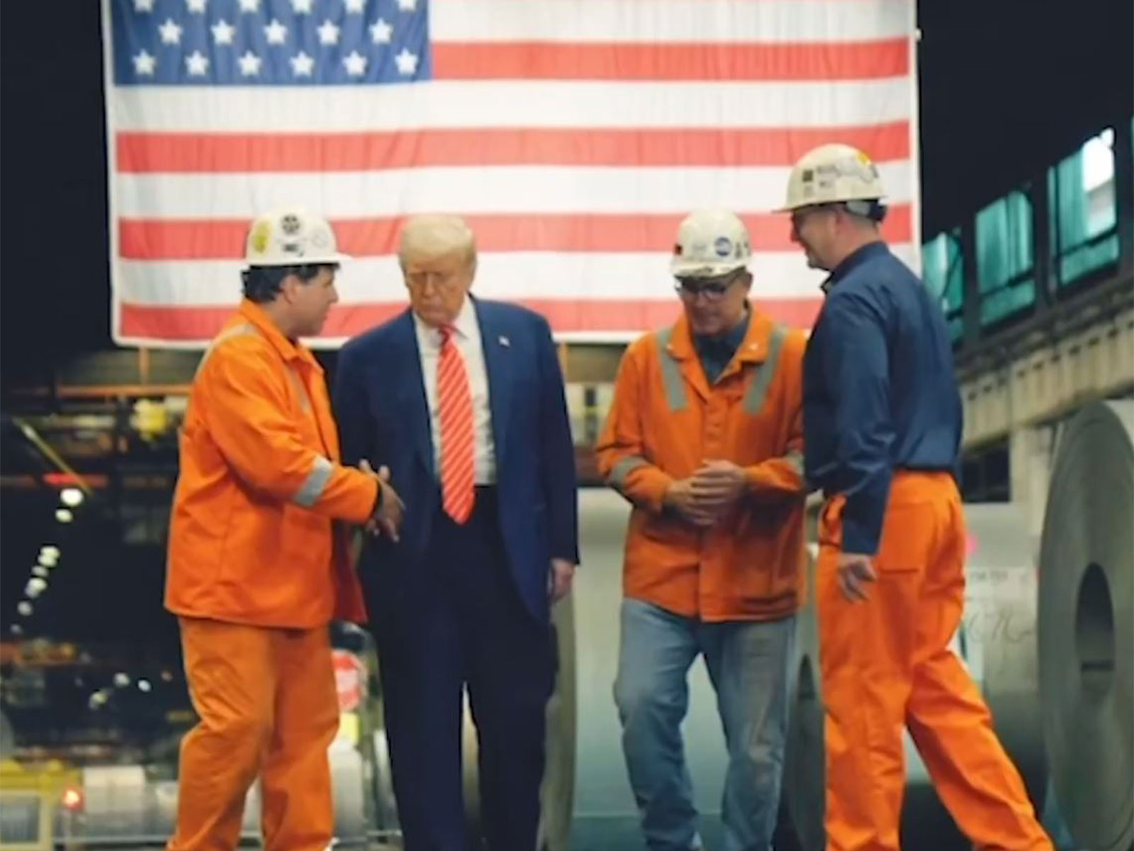 US President Donald Trump with factory workers (Image: X@USDOL)