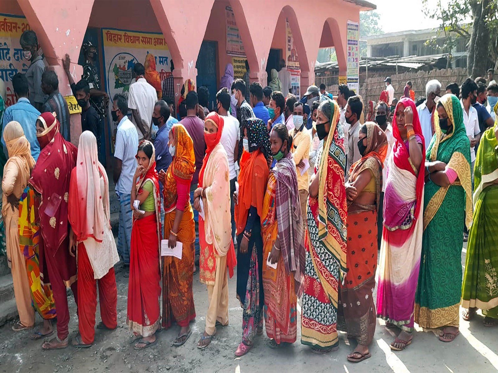 Voters stand in queues at the polling station to cast votes. (File Photo/ANI)