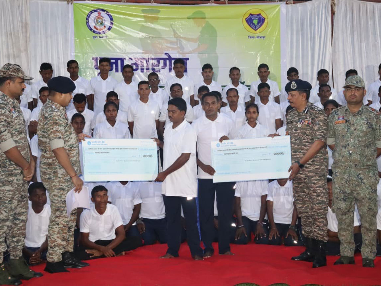 Maoists who  joined mainstream society receive cheques of Rs 50,000 as incentive (Photo/ANI)