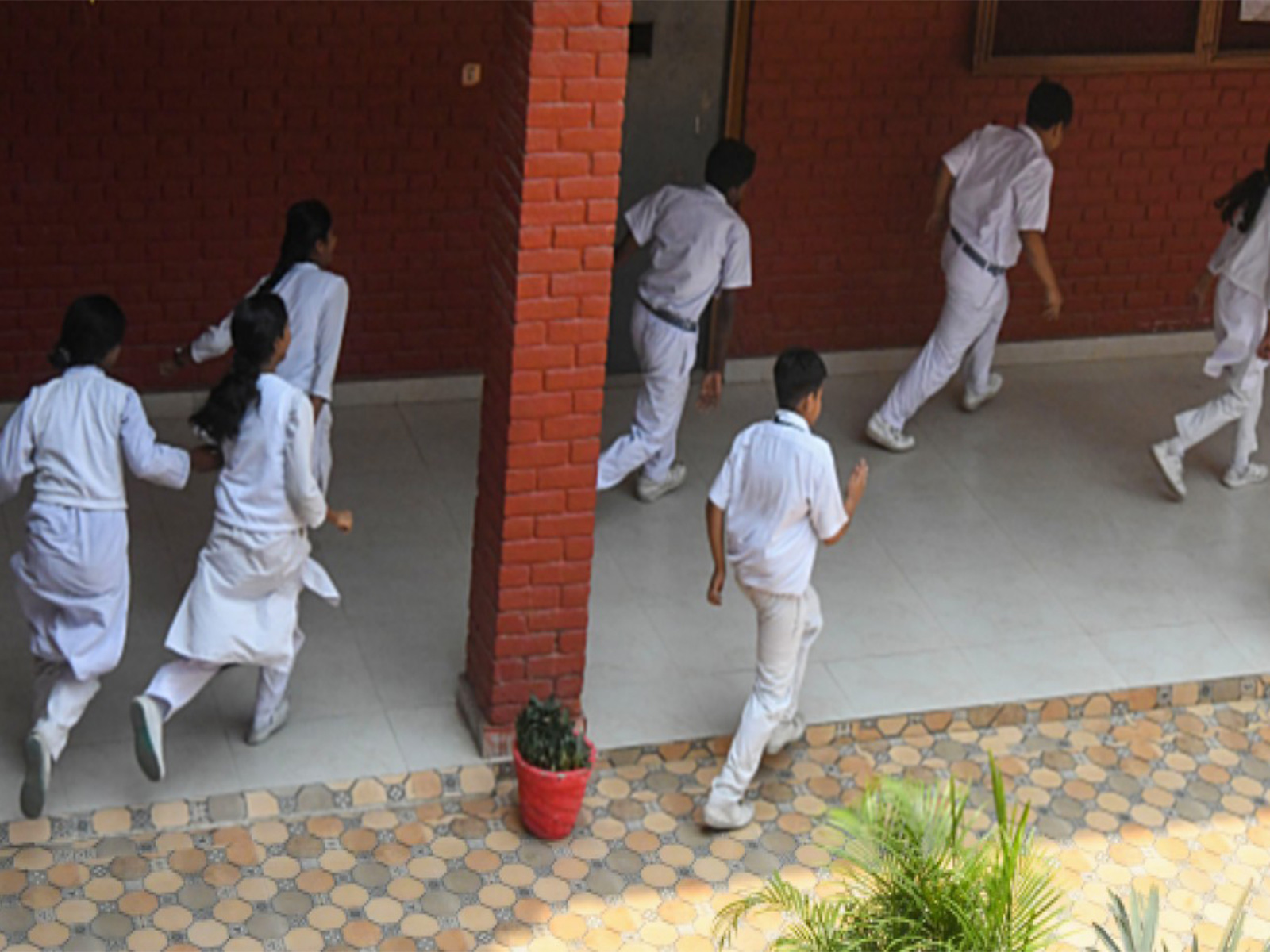School students in Kerala running  on the school ground (Photo/ANI) 