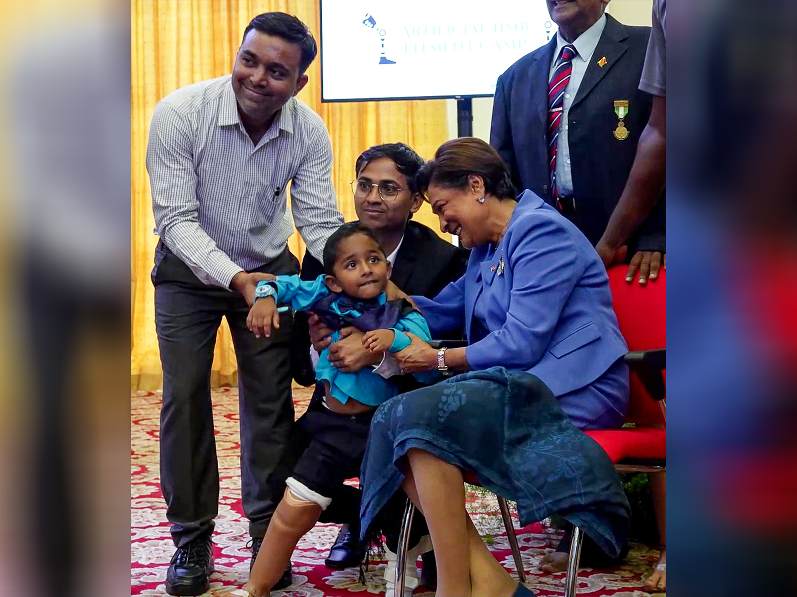 PM of Trinidad and Tobago Kamla Persad-Bissessar with recipients of the Jaipur Foot Artificial Limb Fitment Camp (Photo/ANI)
