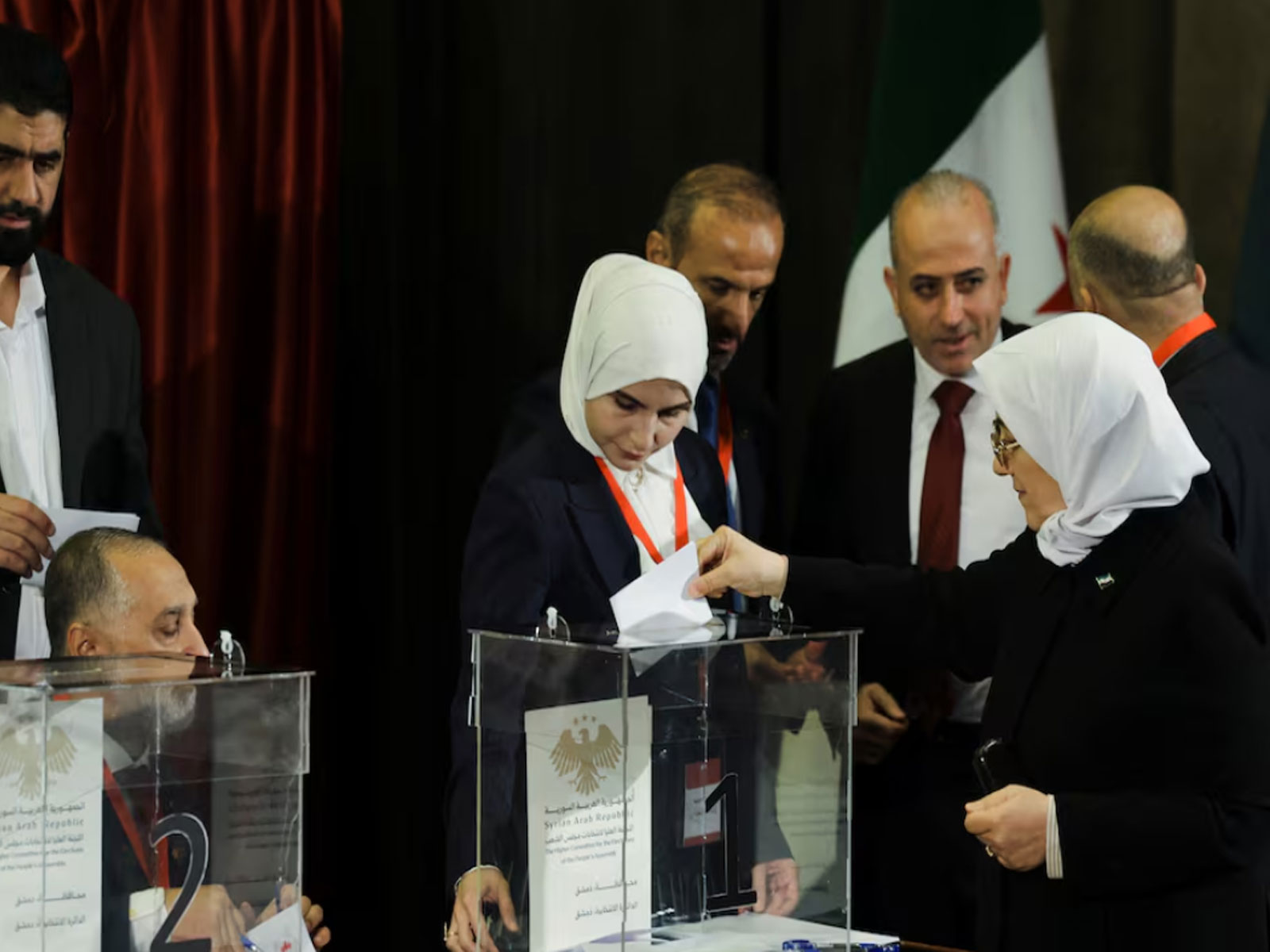 A member of the electoral colleges votes to select her candidate for the new Syrian Parliament (Photo/ Reuters)