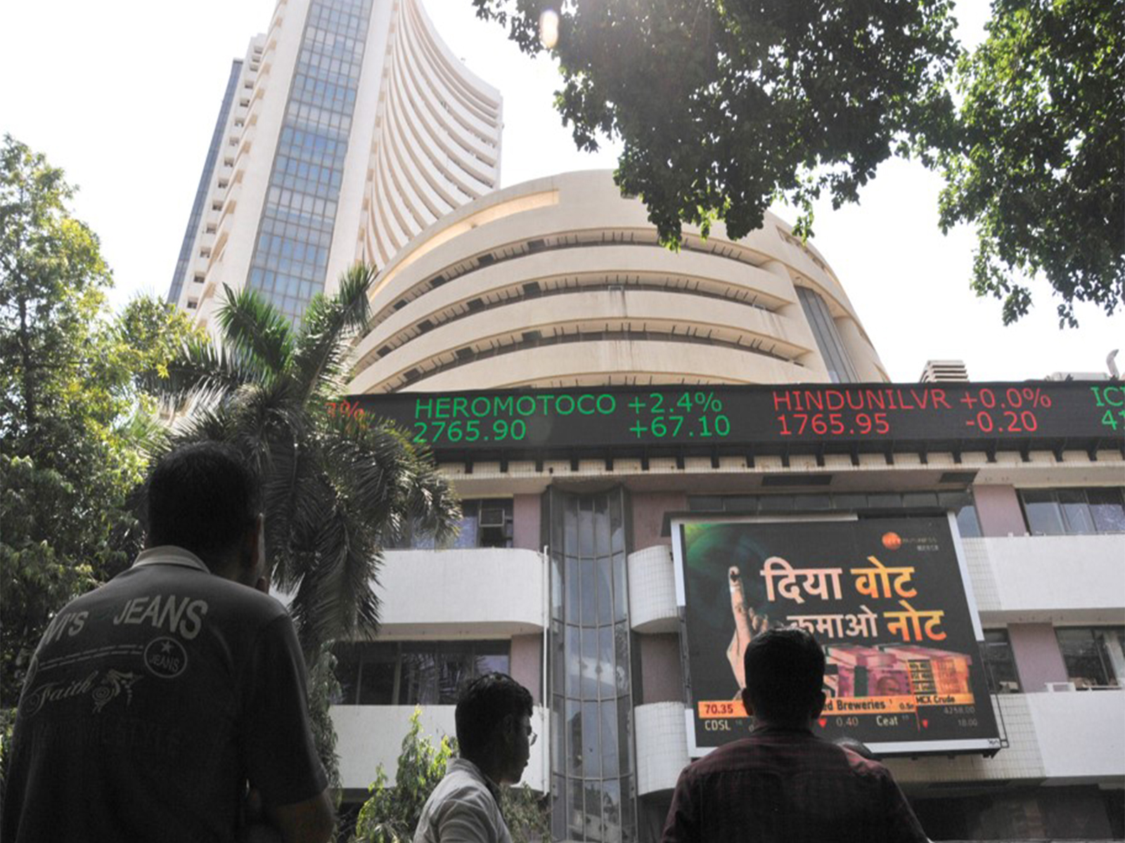 People look at the screen on BSE building. (File Photo/ANI)