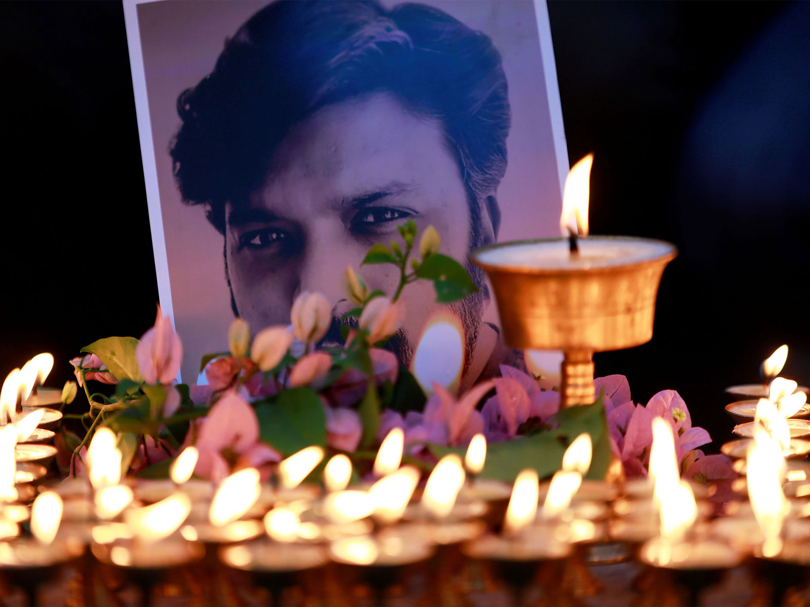 Butter lamps in honour of Reuters journalist Danish Siddiqui (Photo/Reuters)