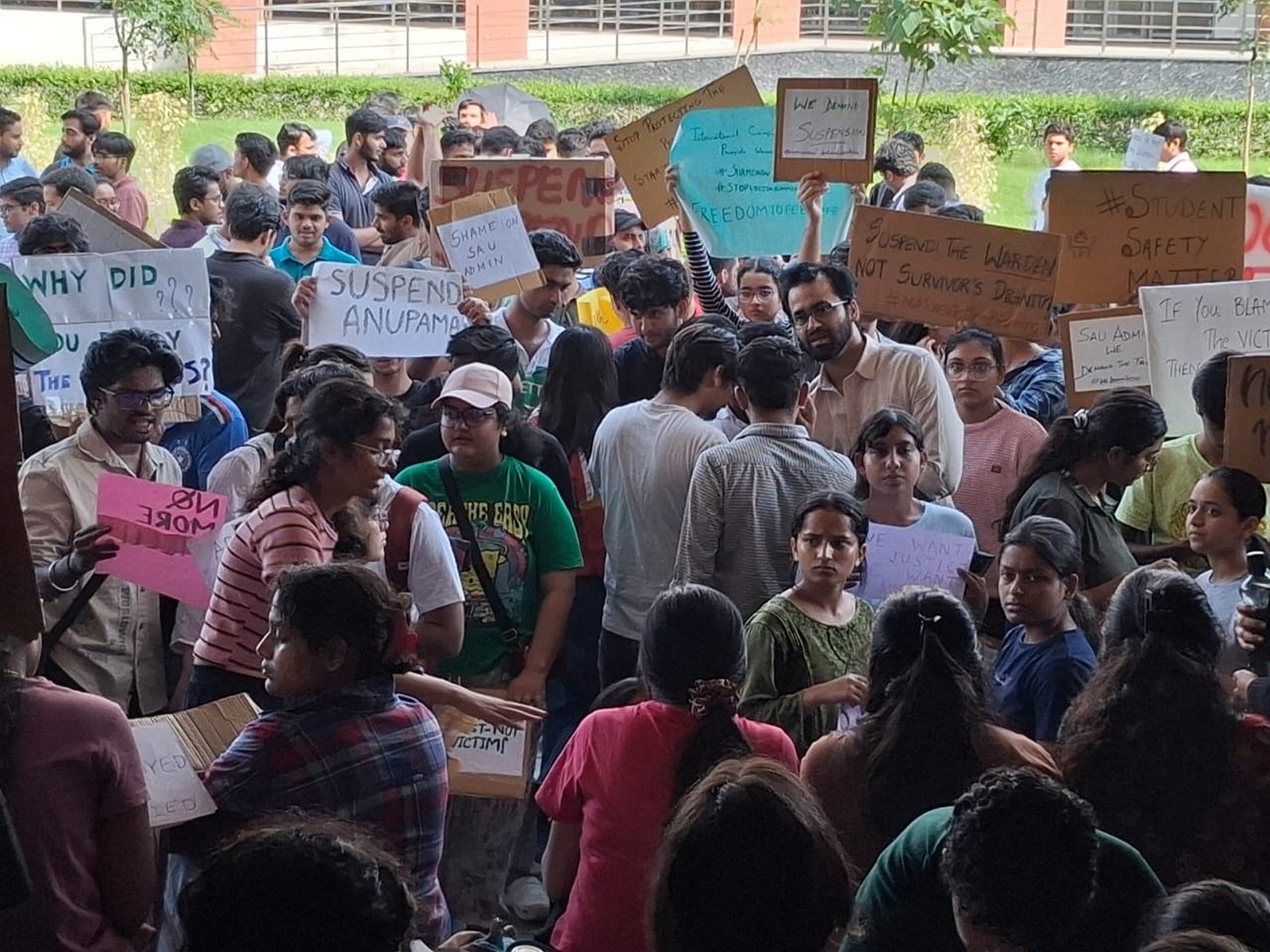 SAU students protest outside the administrative block demanding action in the sexual assault case (Photo/ANI)