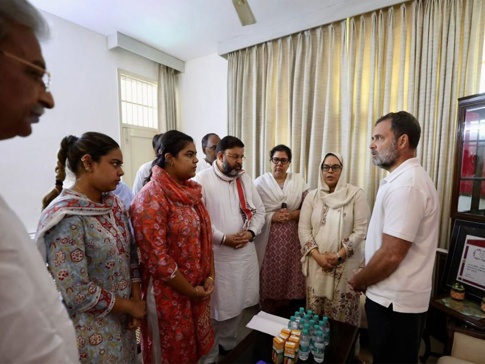 Congress MP Rahul Gandhi with family of IPS Puran Kumar (Photo: ANI)