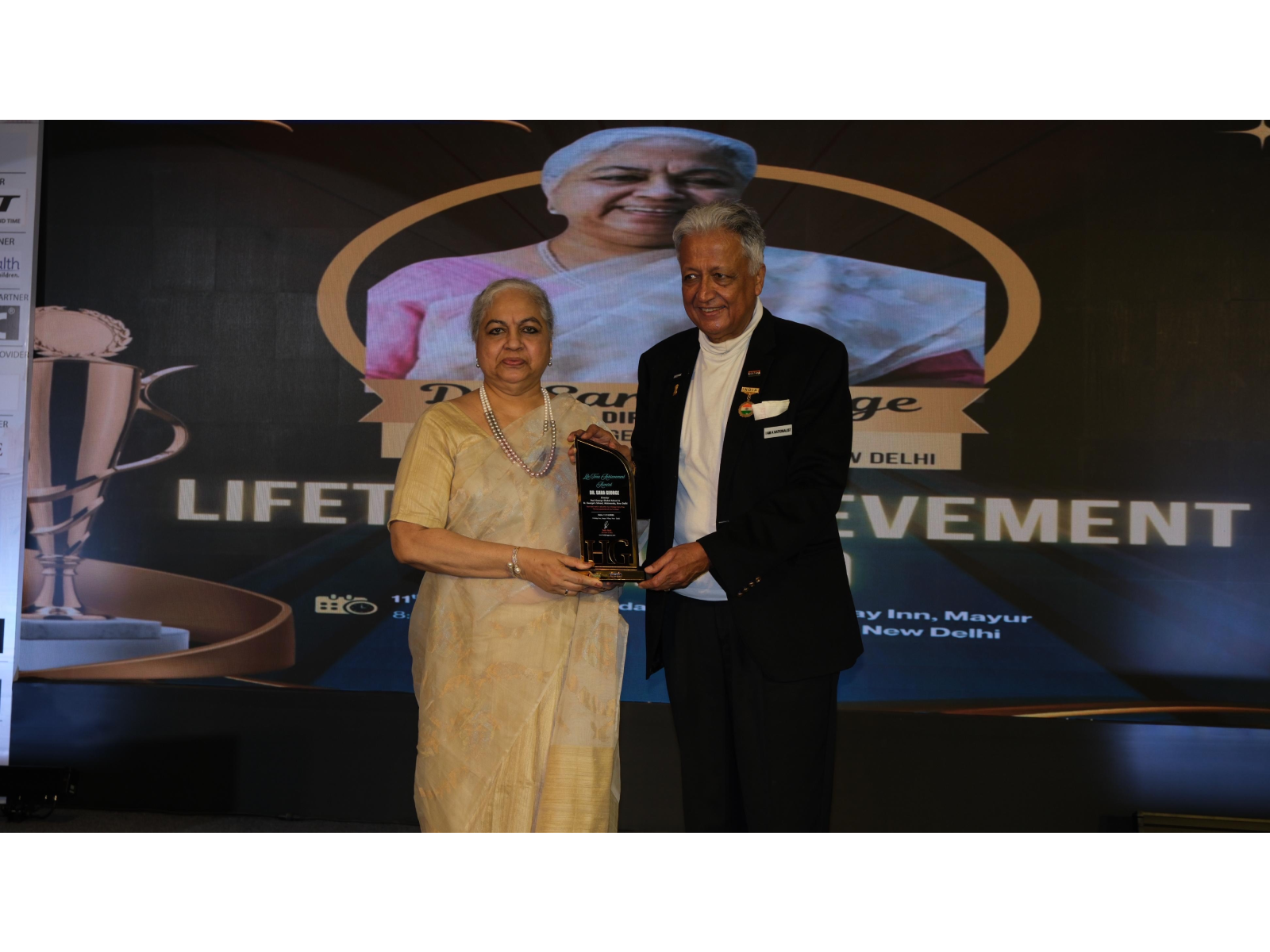 Dr. Sara George Muthoot receiving the Lifetime Achievement Award from Ambassador Deepak Vohra, Former Indian Diplomat and Special Advisor, at a ceremony held in New Delhi