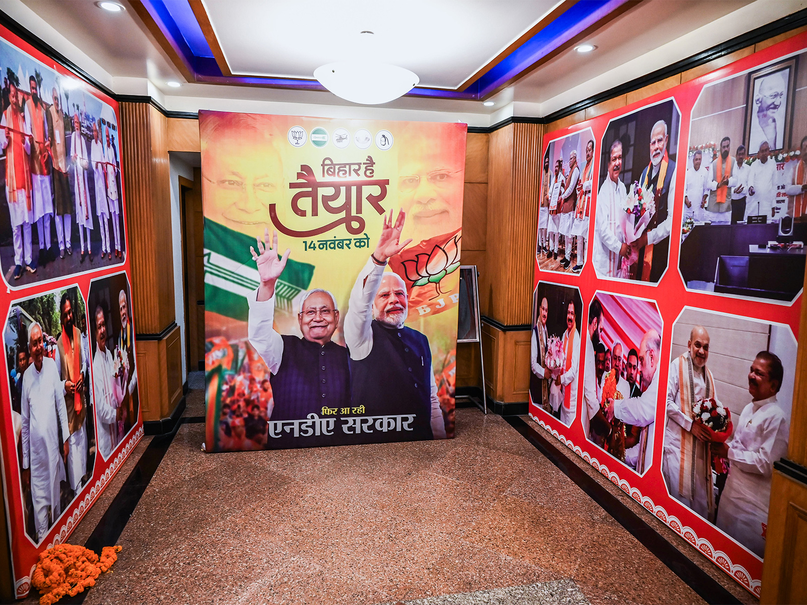 Poster of National Democratic Alliance installed at BJP media centre in Patna (Photo: ANI)
