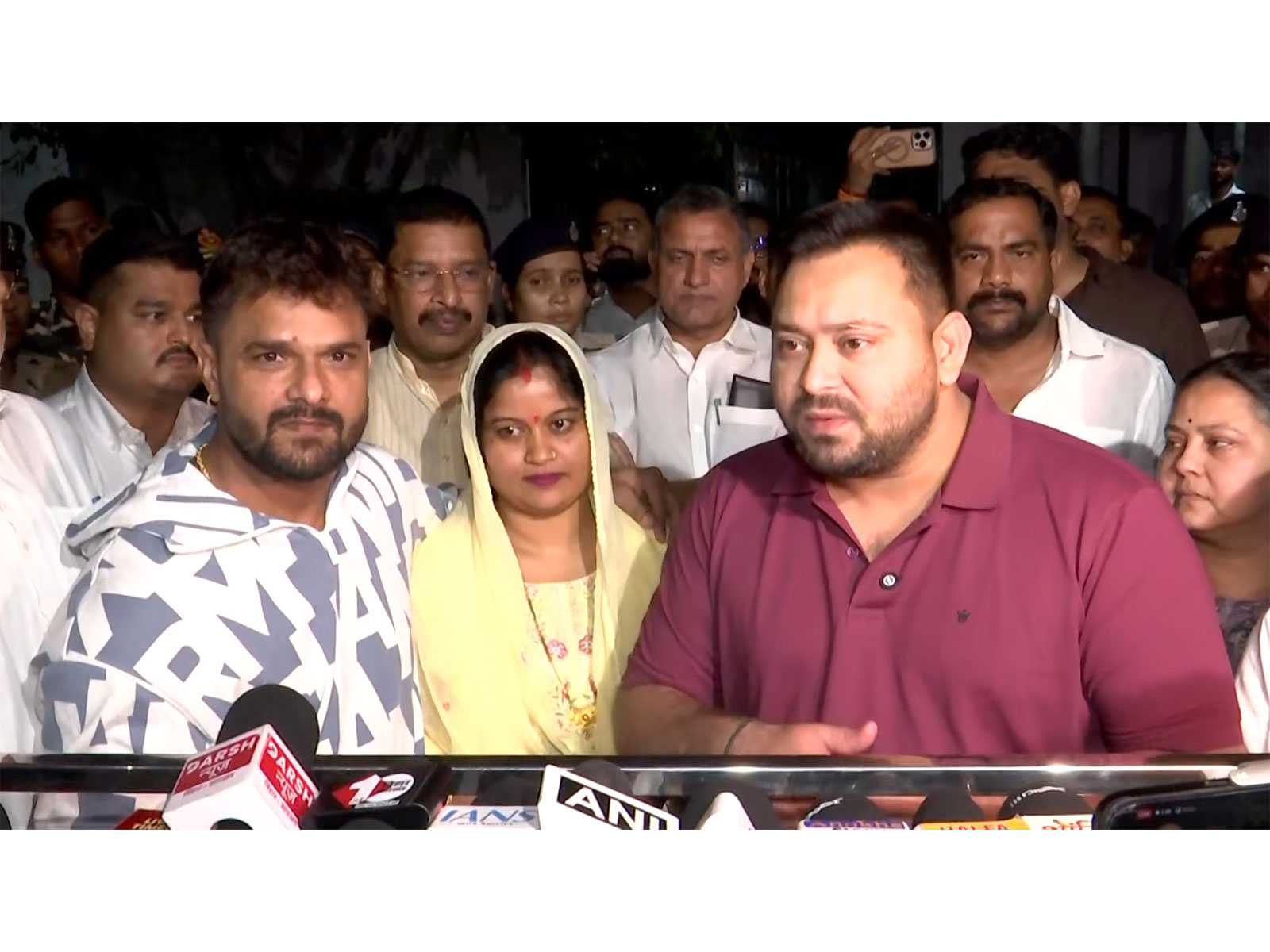 RJD leader Tejashwi Yadav with singer Khesari Lal Yadav. (Photo/ANI)