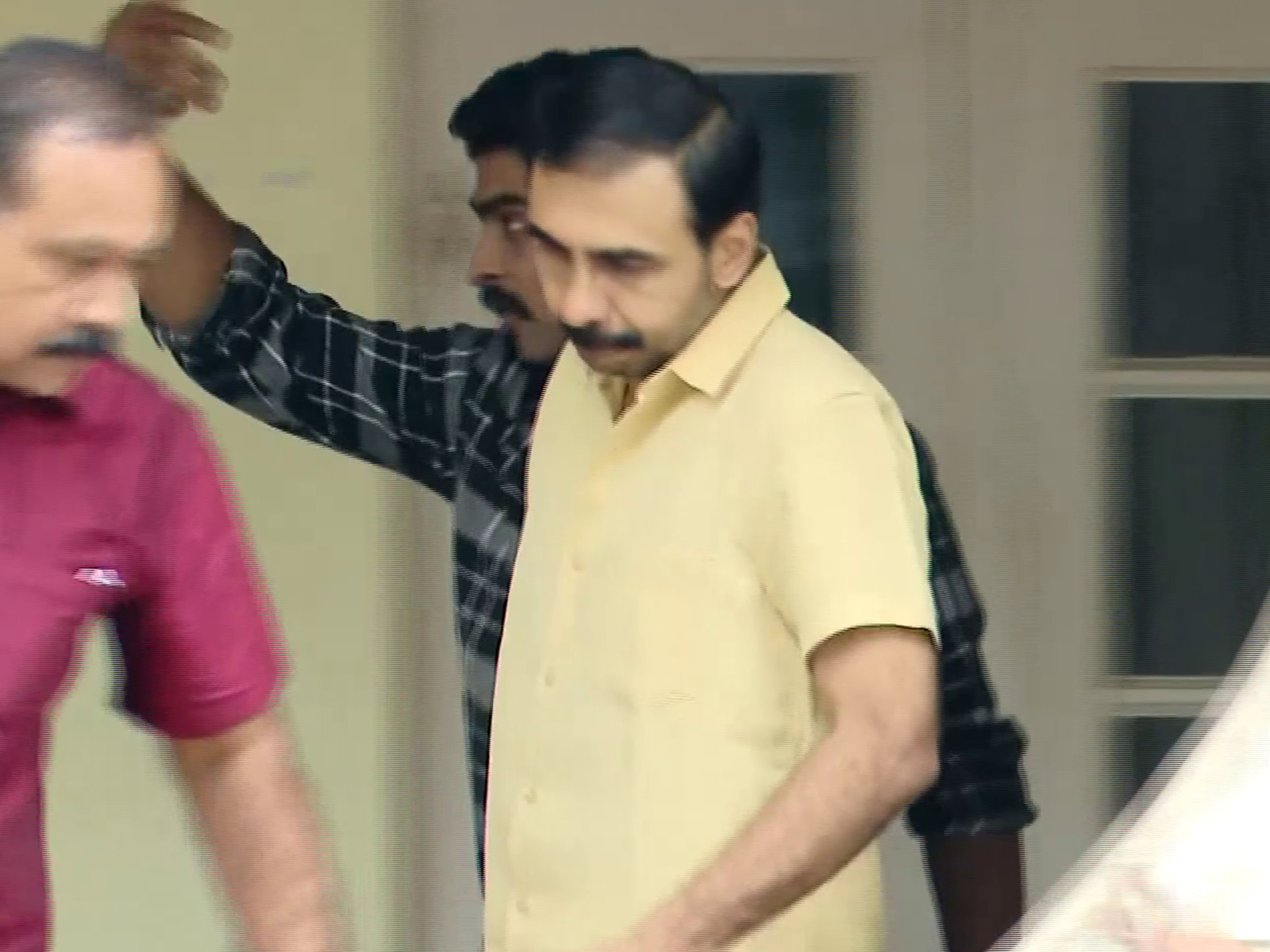 Unnikrishnan Potti (Yellow Shirt) arrested by Kerala Police SIT (Photo/ANI)