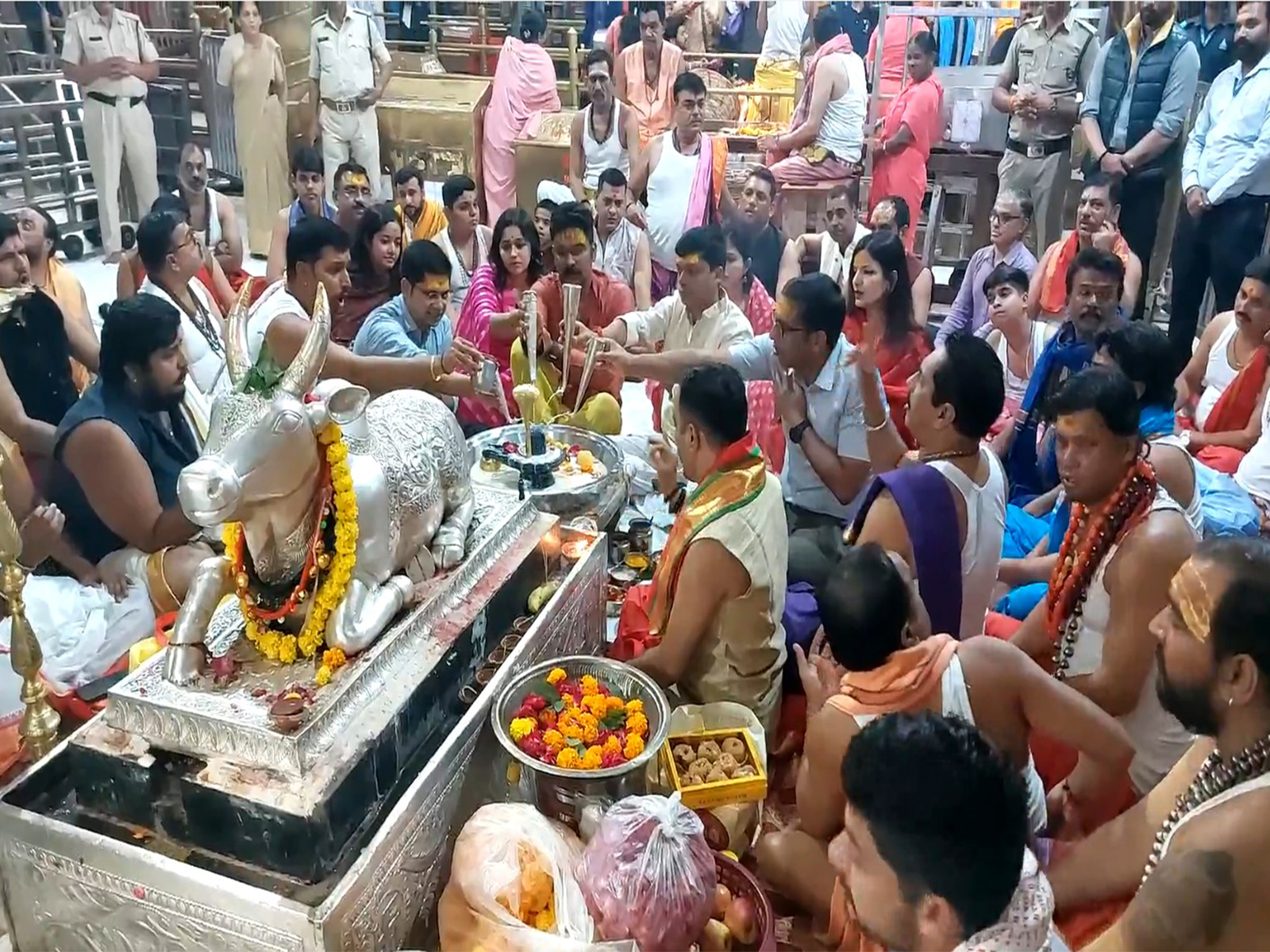 Temple committee members participate in special 'Mahapuja' at Mahakaleshwar temple on Dhanteras. (Photo/ANI)
