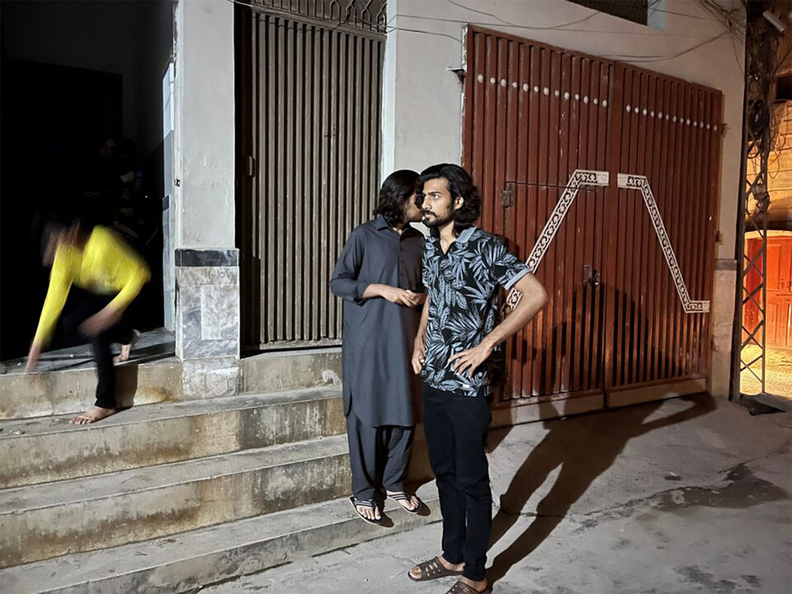 People stand outside their house after a tremor was felt (Photo/Reuters)