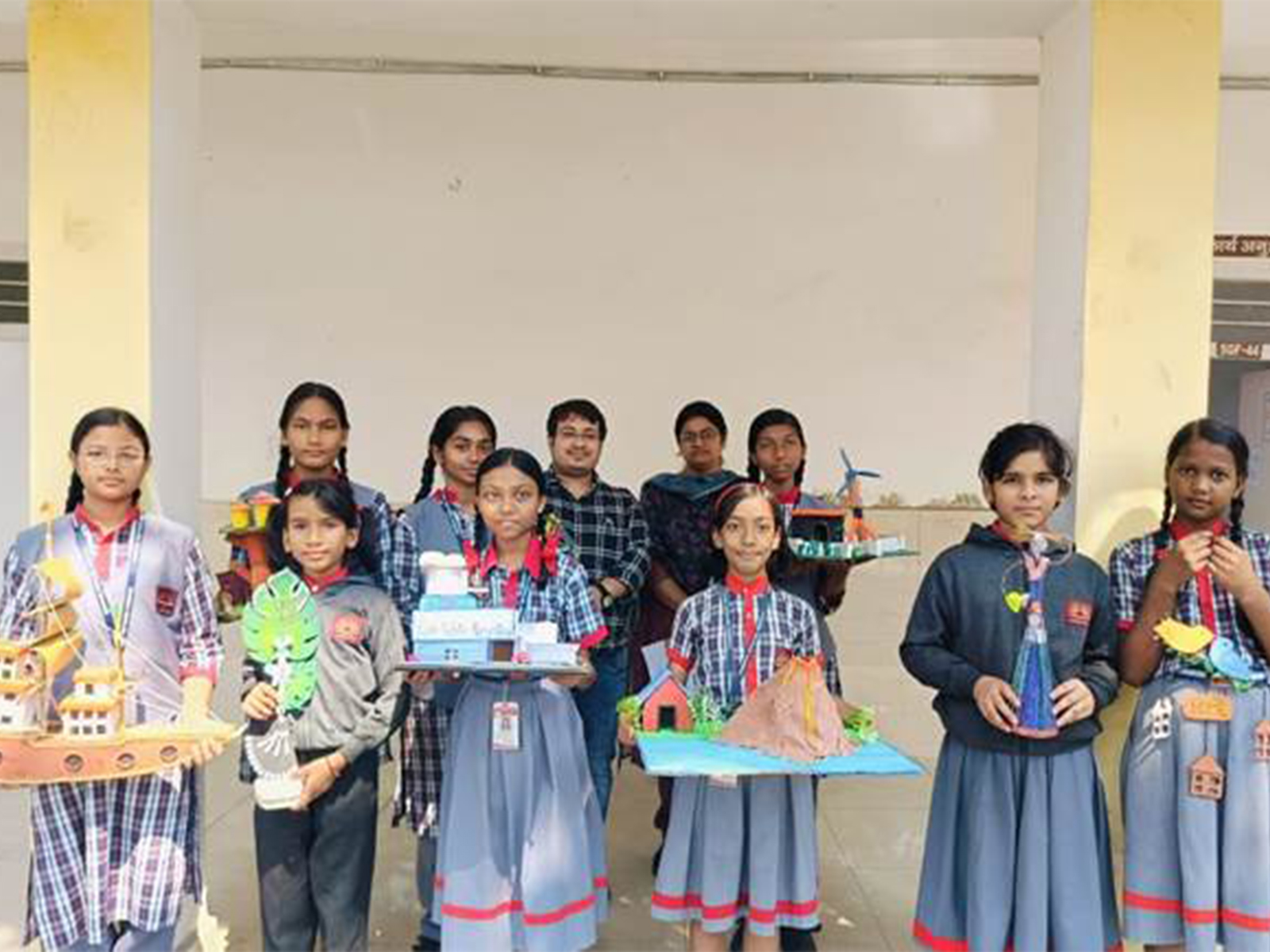 Students showcasing creative ideas on recycling and reusing scrap materials. (Photo/ANI)