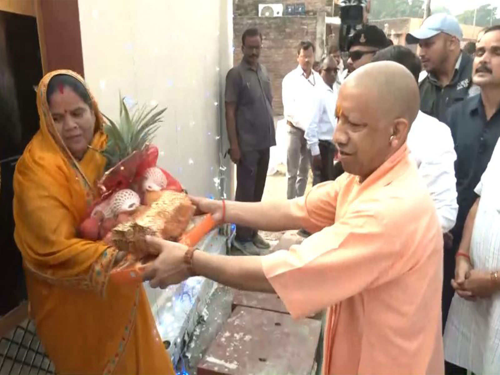 UP CM Yogi Adityanath distributes sweets, fruits to the people in Ayodhya on the occasion of Diwali (Photo/ANI)