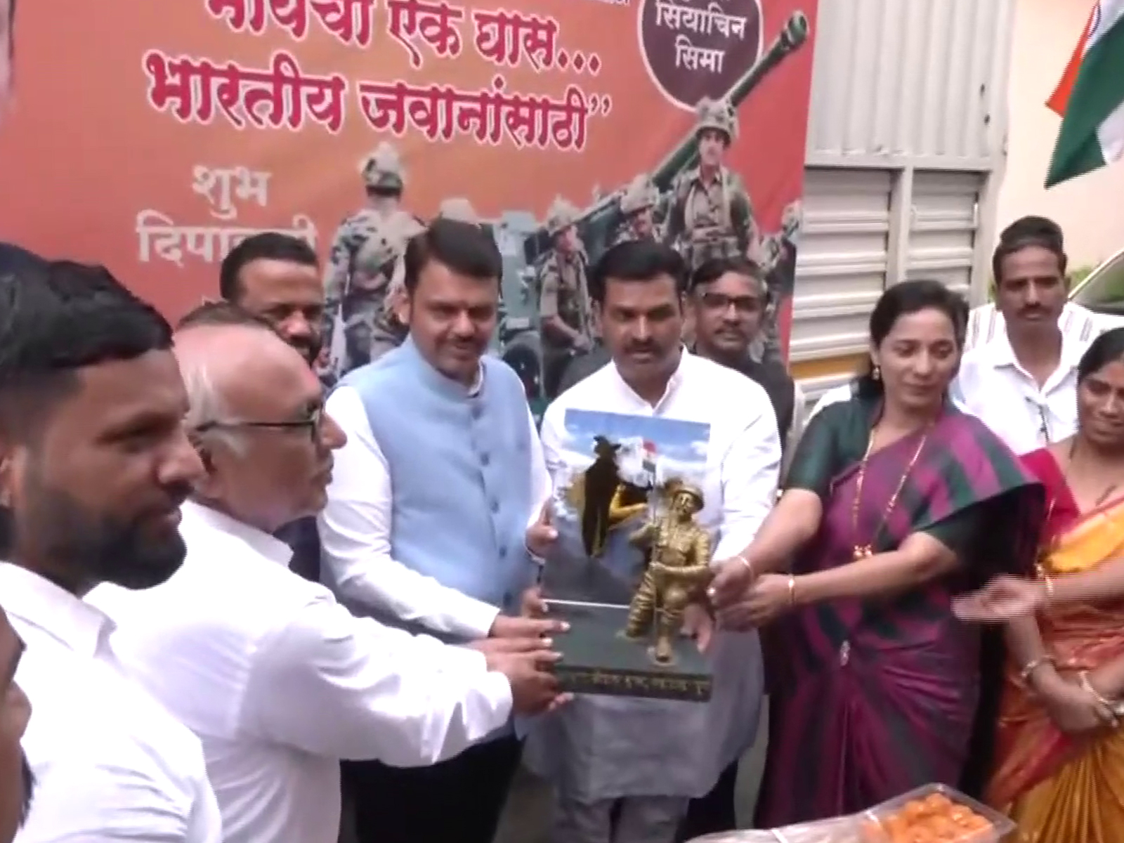 Maharashtra CM Devendra Fadnavis flags off trucks carying Diwali sweets for jawans. (Photo/ANI)